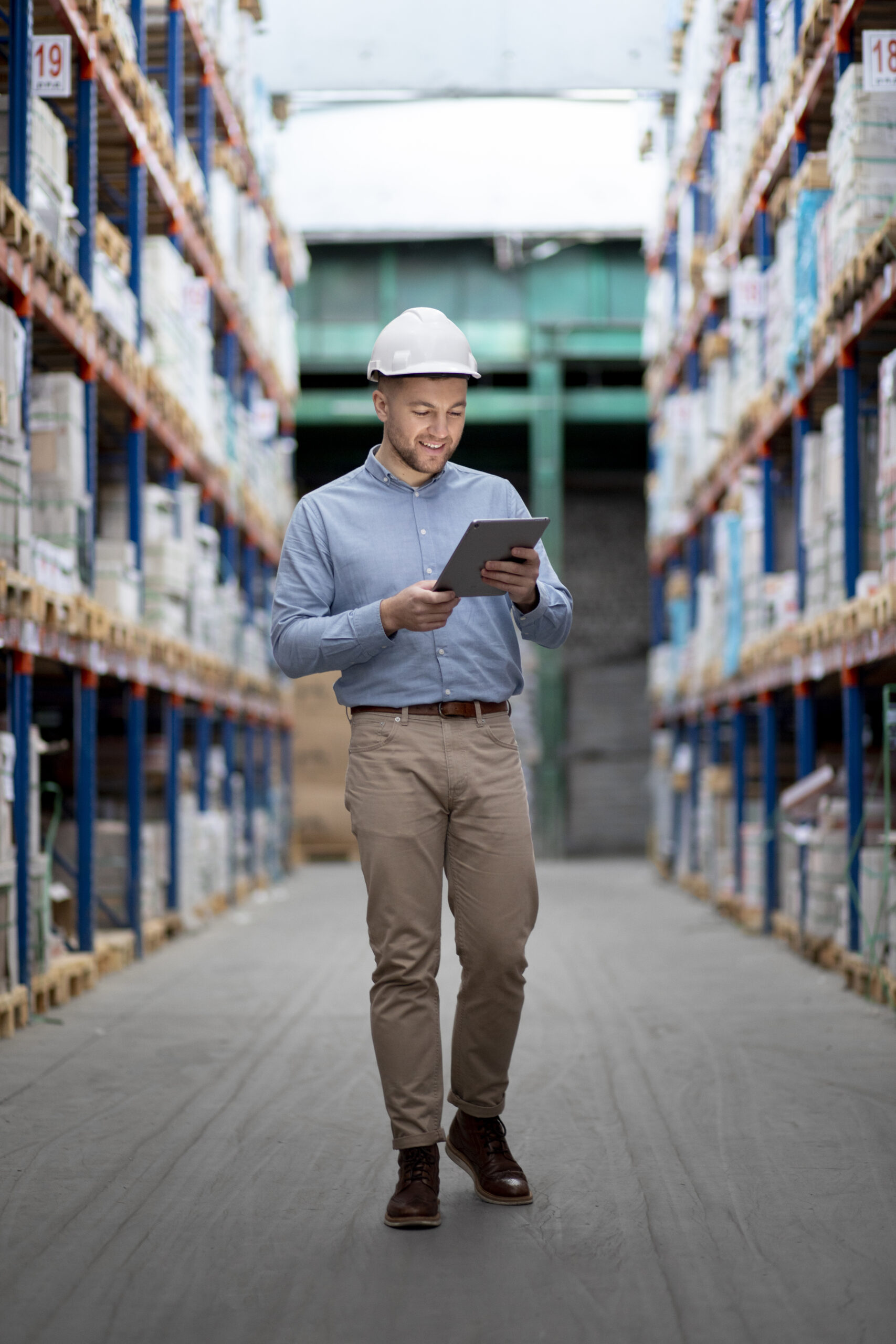 full shot man holding tablet